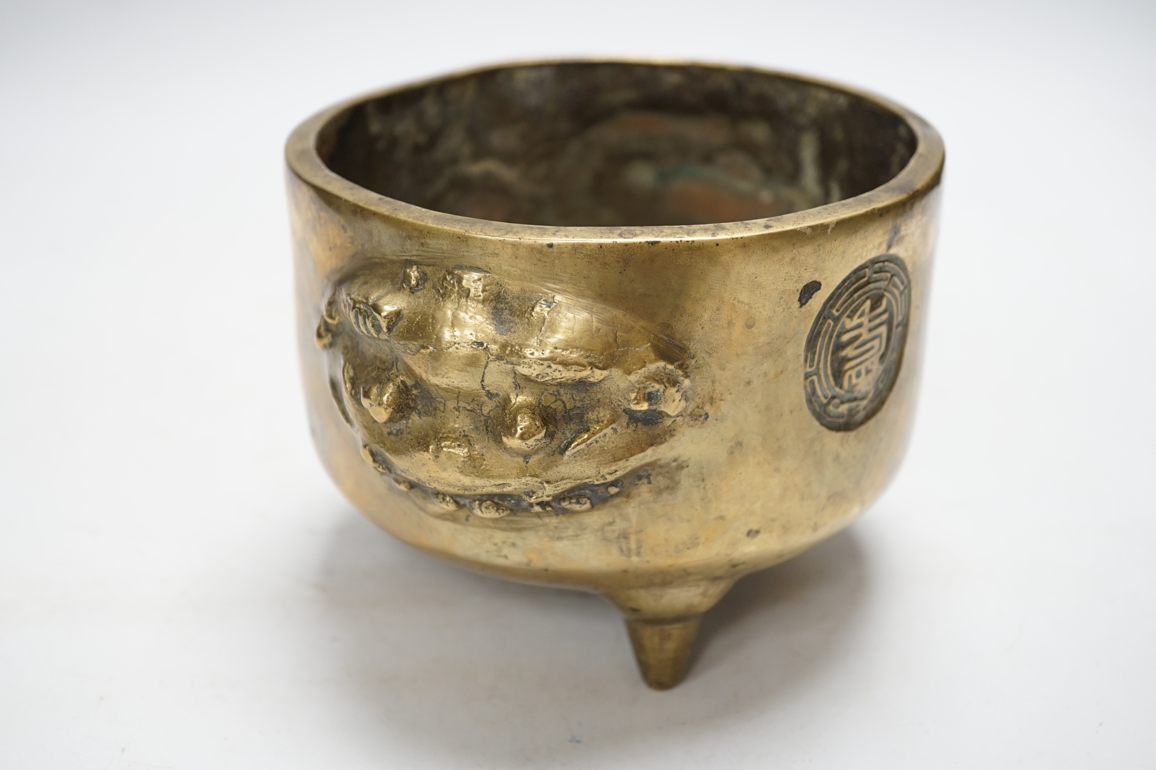 A Chinese bronze tripod censer, 18cm. Condition - fair to good